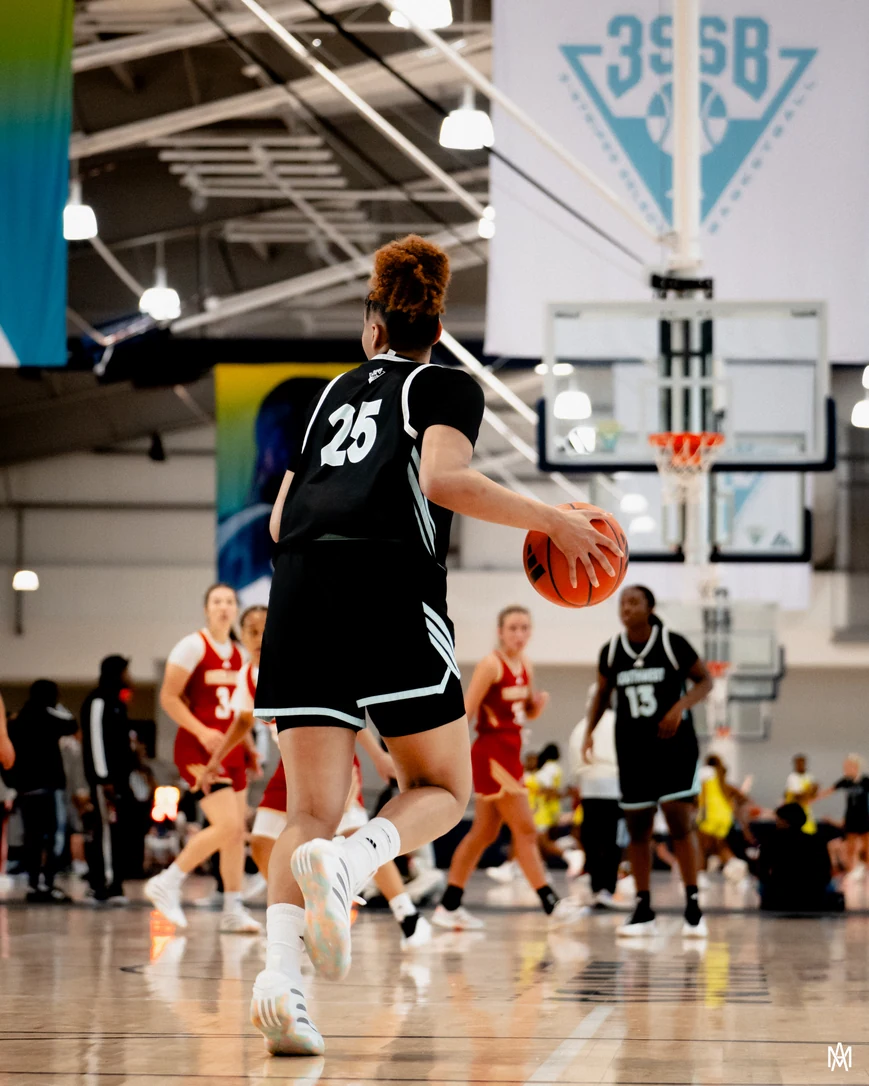 Amayah Garcia pushing the ball up the floor in her black Southwest Select number 25 jersey, beneath a 3SSB banner.