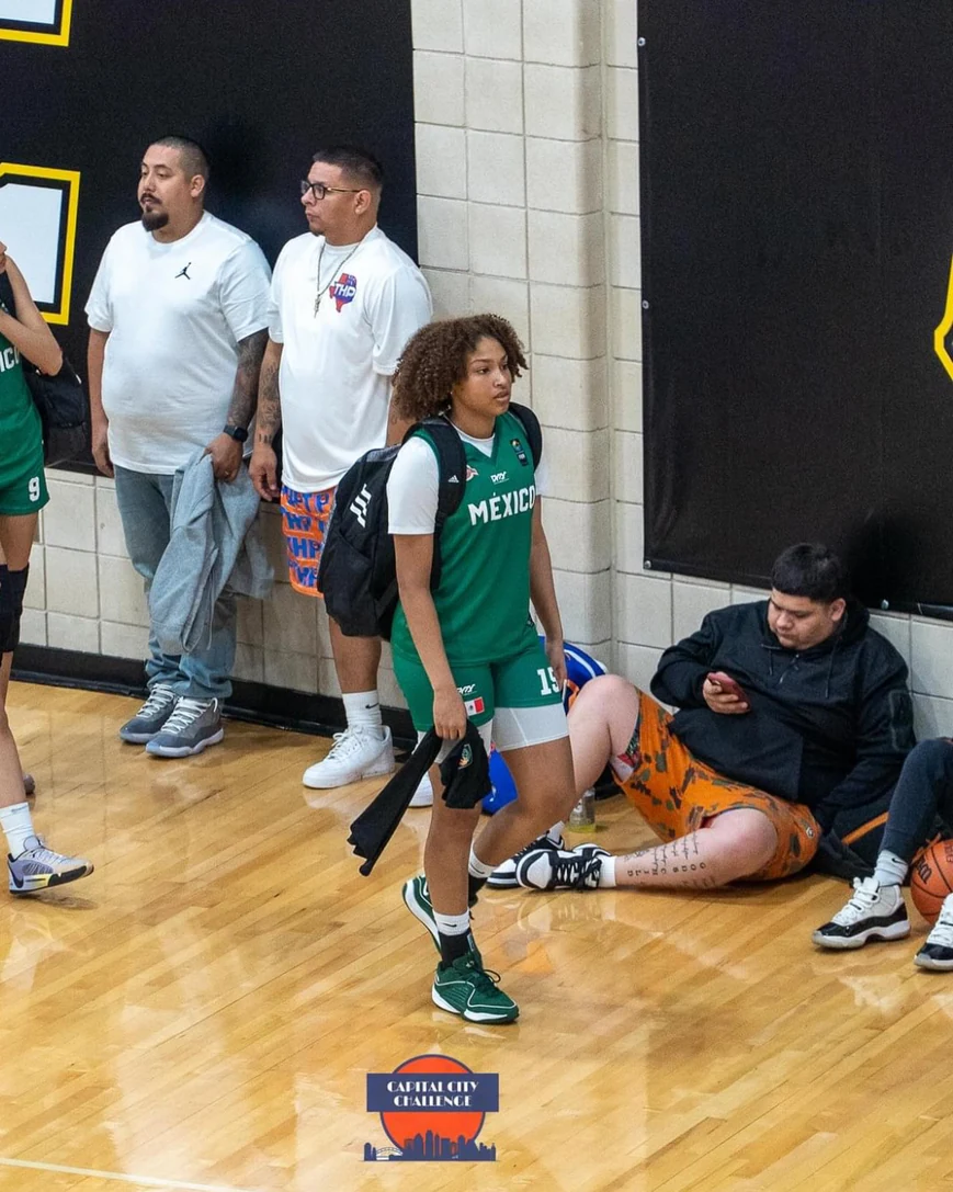 Amayah Garcia in her green number 15 national team uniform, walking off the court with her bag at the Capital City Challenge.
